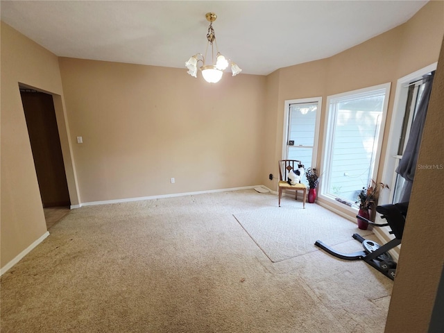 2975 E Withlacoochee Trl, Dunnellon, FL 34434 - spare room with a chandelier and carpet
