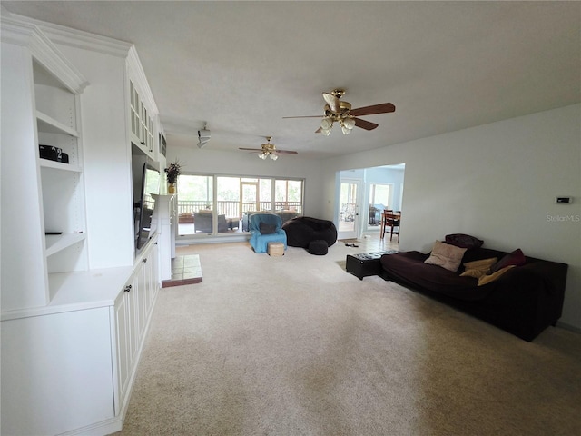 2975 E Withlacoochee Trl, Dunnellon, FL 34434 - living area featuring light carpet, a ceiling fan, and built in shelves