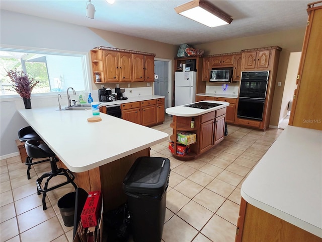 2975 E Withlacoochee Trl, Dunnellon, FL 34434 - kitchen with open shelves, black appliances, a peninsula, a breakfast bar, and light tile patterned floors