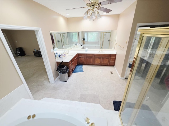 2975 E Withlacoochee Trl, Dunnellon, FL 34434 - bathroom featuring a garden tub, a ceiling fan, double vanity, and a stall shower
