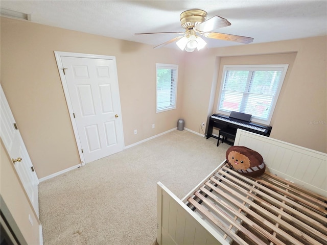 2975 E Withlacoochee Trl, Dunnellon, FL 34434 - carpeted bedroom featuring ceiling fan and baseboards