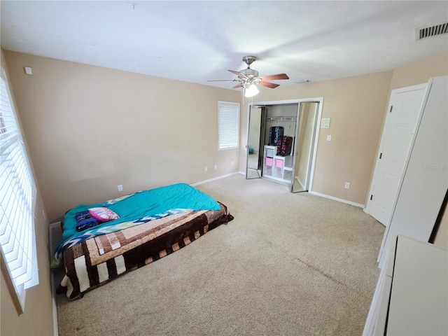 2975 E Withlacoochee Trl, Dunnellon, FL 34434 - bedroom featuring light carpet and a ceiling fan