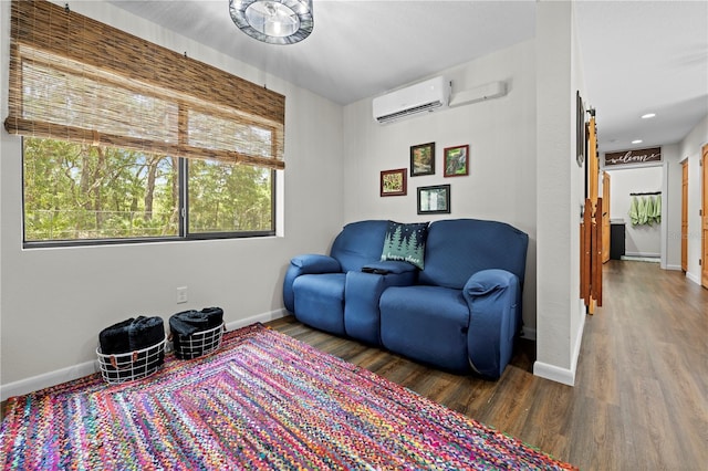 7013 W Polaris Ct, Homosassa, FL 34446 - sitting room with wood finished floors, a wall unit AC, healthy amount of natural light, and a barn door