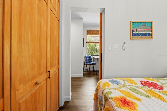 7013 W Polaris Ct, Homosassa, FL 34446 - bedroom featuring dark wood finished floors and baseboards
