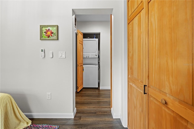 7013 W Polaris Ct, Homosassa, FL 34446 - corridor featuring stacked washer / dryer and dark wood-type flooring