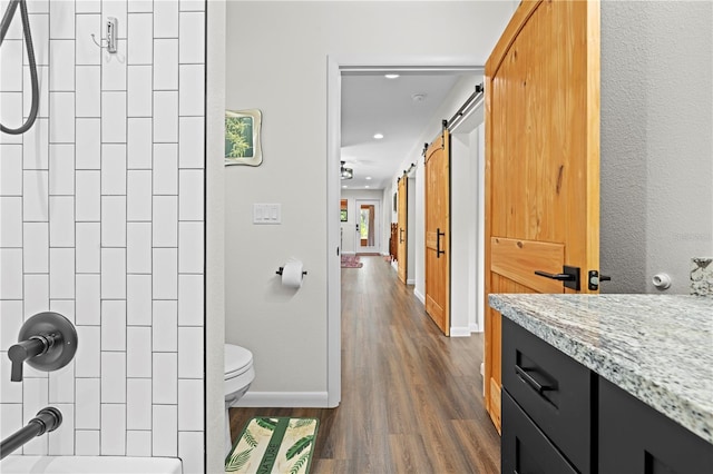 7013 W Polaris Ct, Homosassa, FL 34446 - bathroom featuring vanity, wood finished floors, recessed lighting, and  shower combination