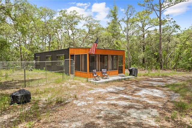 7013 W Polaris Ct, Homosassa, FL 34446 - rear view of property with a sunroom and driveway