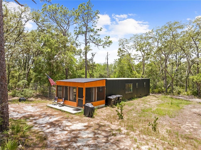 7013 W Polaris Ct, Homosassa, FL 34446 - rear view of house featuring an outdoor structure