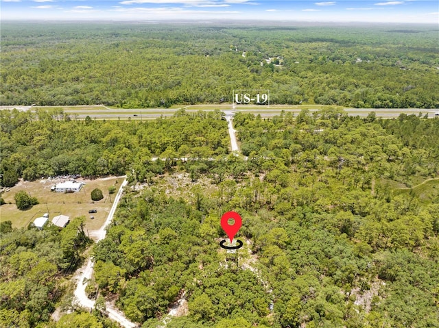 7013 W Polaris Ct, Homosassa, FL 34446 - aerial view of property's location featuring a heavily wooded area
