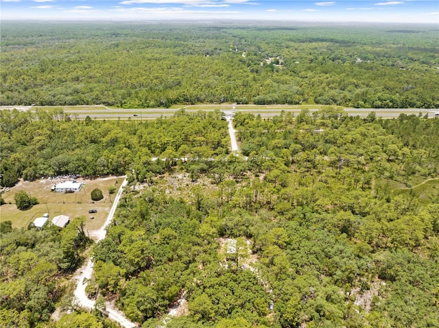 7013 W Polaris Ct, Homosassa, FL 34446 - aerial view of property and surrounding area featuring a forest