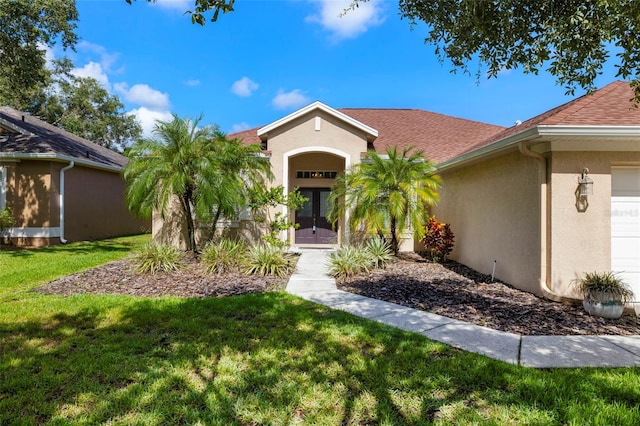 19104 Cellini Pl, Lutz, FL 33558 - property entrance featuring french doors, stucco siding, a lawn, an attached garage, and a shingled roof