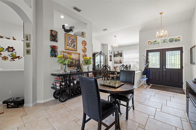 19104 Cellini Pl, Lutz, FL 33558 - dining room with a chandelier, arched walkways, and french doors
