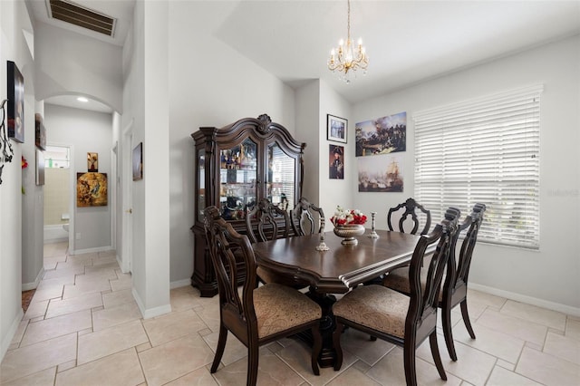 19104 Cellini Pl, Lutz, FL 33558 - dining space with arched walkways, a chandelier, and high vaulted ceiling