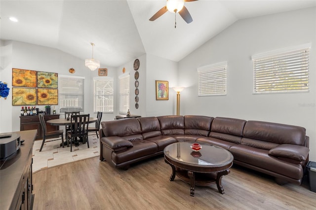 19104 Cellini Pl, Lutz, FL 33558 - living room featuring vaulted ceiling, a ceiling fan, light wood-style flooring, and plenty of natural light