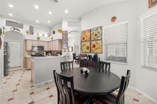 19104 Cellini Pl, Lutz, FL 33558 - dining room with recessed lighting, light tile patterned floors, and arched walkways