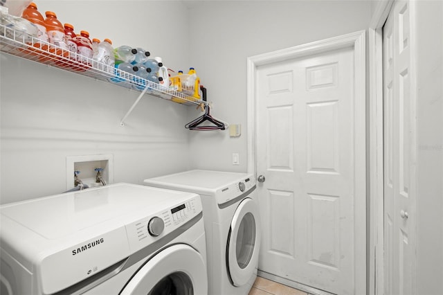 19104 Cellini Pl, Lutz, FL 33558 - laundry area with washing machine and dryer and light tile patterned flooring
