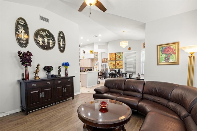 19104 Cellini Pl, Lutz, FL 33558 - living area featuring lofted ceiling, a ceiling fan, and wood finished floors