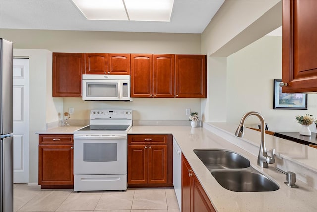 7932 Sailboat Key Blvd S Unit 406, South Pasadena, FL 33707 - kitchen featuring white appliances and light tile patterned flooring