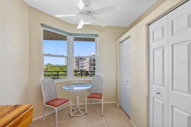 7932 Sailboat Key Blvd S Unit 406, South Pasadena, FL 33707 - dining room with a ceiling fan, light tile patterned floors, and a textured ceiling