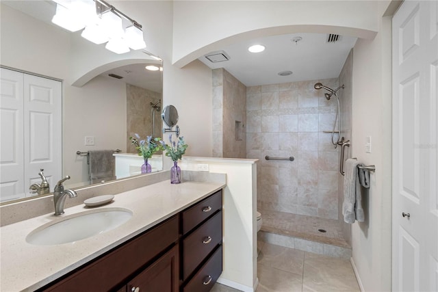 7932 Sailboat Key Blvd S Unit 406, South Pasadena, FL 33707 - bathroom with a tile shower, vanity, and tile patterned flooring