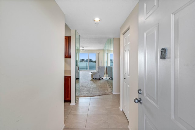 7932 Sailboat Key Blvd S Unit 406, South Pasadena, FL 33707 - hall with light colored carpet, light tile patterned floors, and recessed lighting