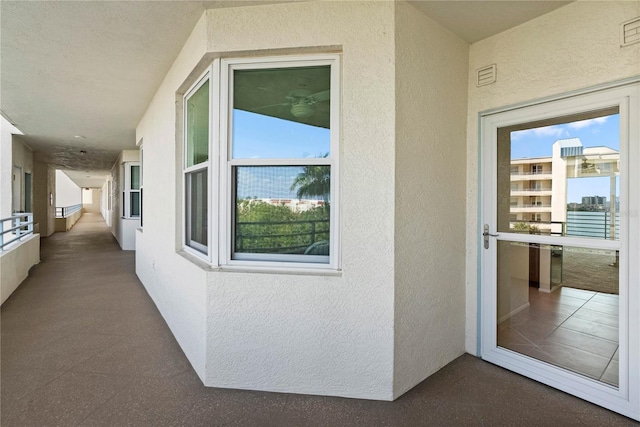 7932 Sailboat Key Blvd S Unit 406, South Pasadena, FL 33707 - entrance to property with stucco siding and a balcony