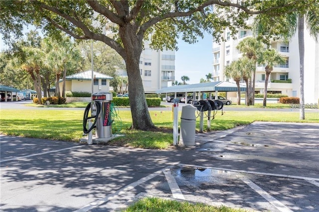 7932 Sailboat Key Blvd S Unit 406, South Pasadena, FL 33707 - view of home's community with a lawn and covered and uncovered parking