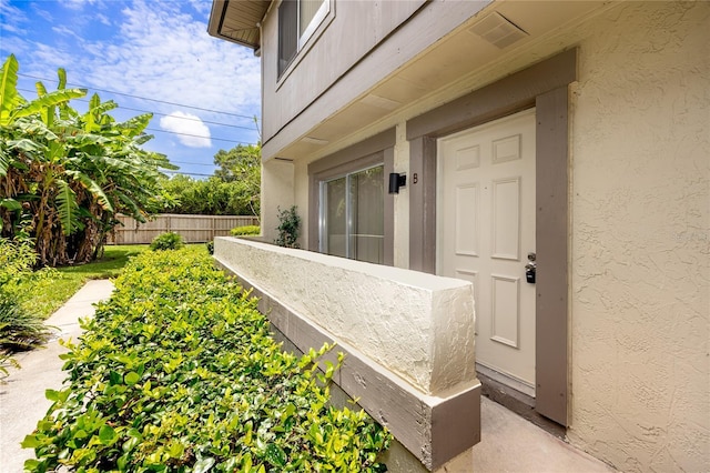 1881 Lichen Ln Unit B, Clearwater, FL 33760 - entrance to property featuring stucco siding