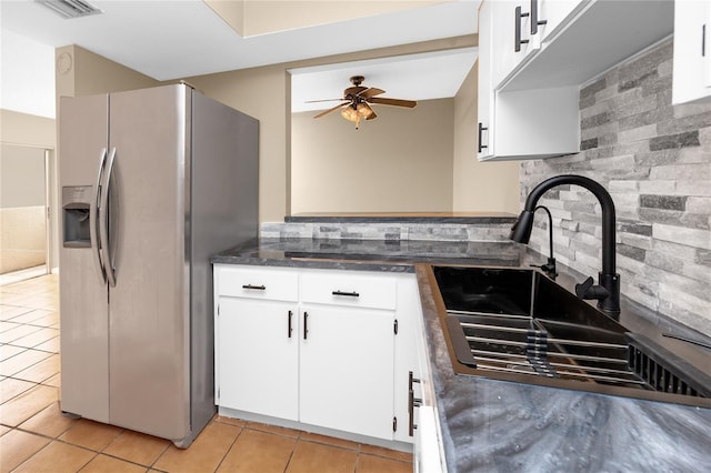 1881 Lichen Ln Unit B, Clearwater, FL 33760 - kitchen featuring stainless steel fridge with ice dispenser, light tile patterned floors, ceiling fan, a sink, and white cabinetry