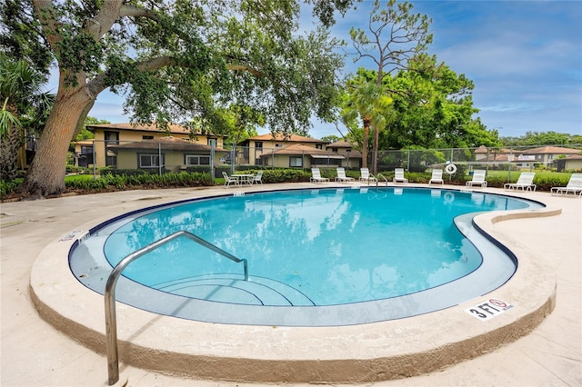 1881 Lichen Ln Unit B, Clearwater, FL 33760 - community pool featuring a residential view and a patio area