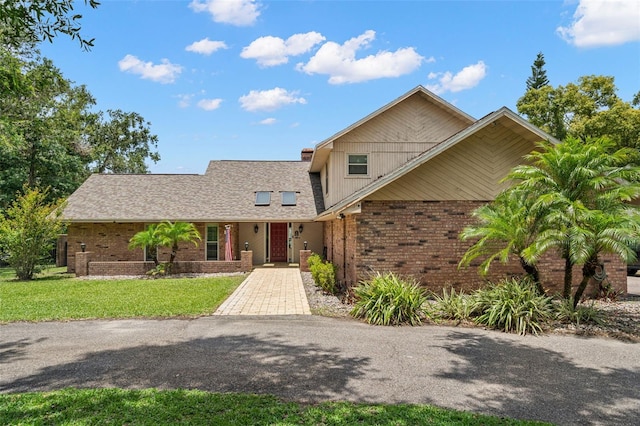 2306 S Valrico Rd, Valrico, FL 33596 - view of front of house with brick siding and a front lawn