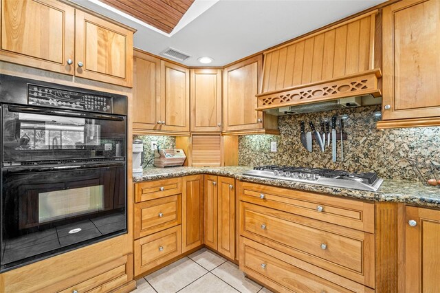 2306 S Valrico Rd, Valrico, FL 33596 - kitchen featuring stainless steel gas cooktop, light tile patterned flooring, decorative backsplash, and stone countertops