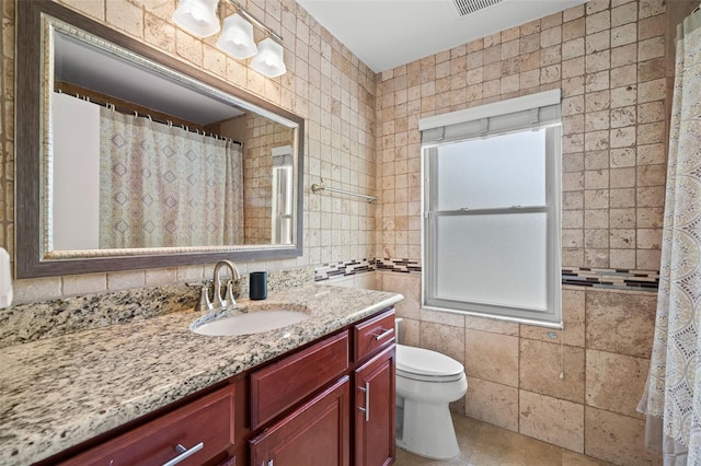 2306 S Valrico Rd, Valrico, FL 33596 - full bathroom with vanity, tile walls, and tile patterned flooring
