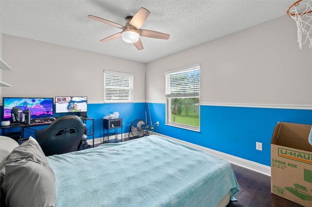 2306 S Valrico Rd, Valrico, FL 33596 - bedroom featuring wood finished floors, a ceiling fan, and a textured ceiling