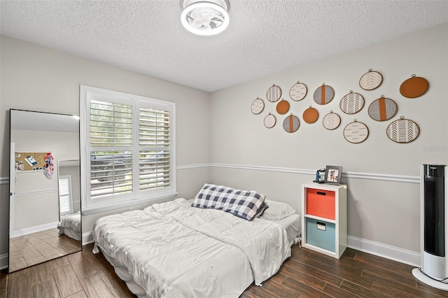 2306 S Valrico Rd, Valrico, FL 33596 - bedroom with wood tiled floors and a textured ceiling