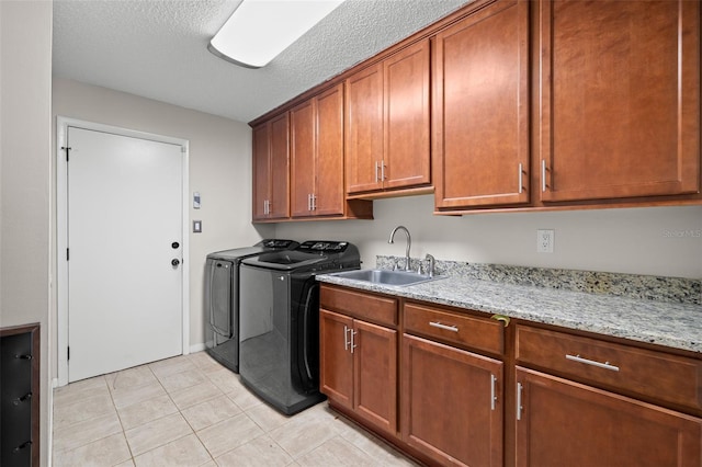 2306 S Valrico Rd, Valrico, FL 33596 - washroom featuring cabinet space, washing machine and clothes dryer, light tile patterned flooring, and a textured ceiling