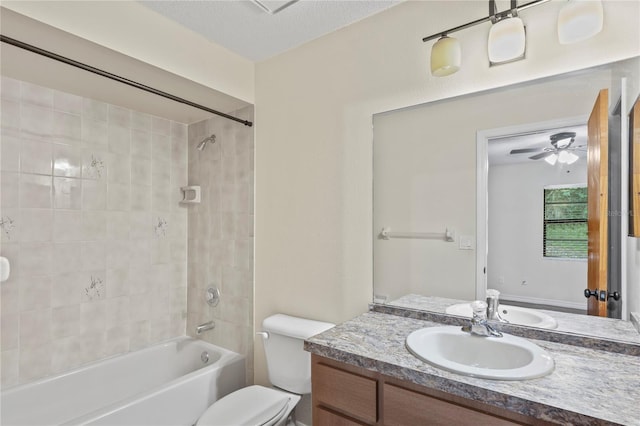 7411 Mead Dr, Spring Hill, FL 34606 - full bath featuring vanity, toilet, bathing tub / shower combination, and ceiling fan