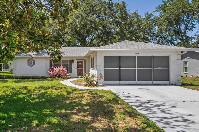 8405 Divot Way, Port Richey, FL 34668 - single story home featuring a garage, driveway, a front yard, and stucco siding