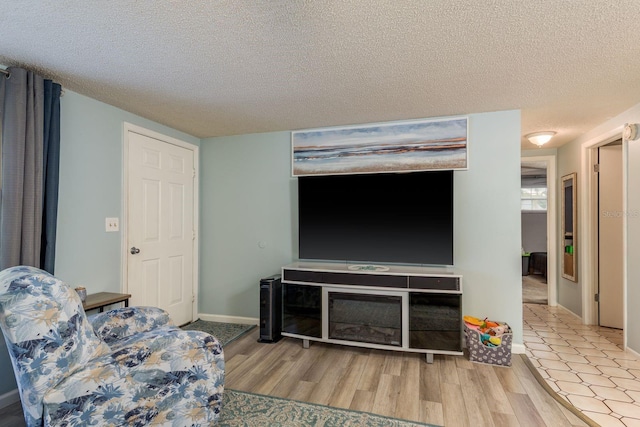 7901 Marlboro Dr, Port Richey, FL 34668 - living area featuring a textured ceiling and wood finished floors