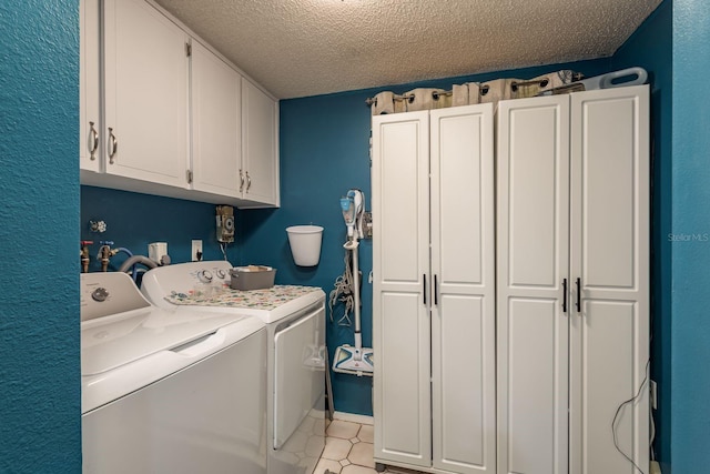 7901 Marlboro Dr, Port Richey, FL 34668 - laundry room with washing machine and clothes dryer, a textured ceiling, and cabinet space