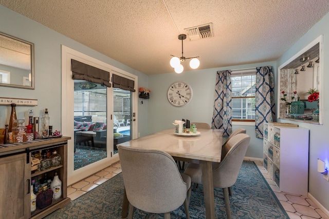 7901 Marlboro Dr, Port Richey, FL 34668 - dining room with a textured ceiling