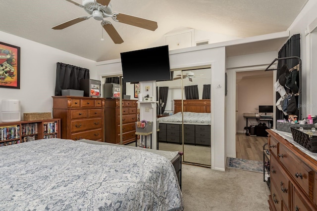 7901 Marlboro Dr, Port Richey, FL 34668 - bedroom featuring vaulted ceiling, light carpet, a closet, and a ceiling fan