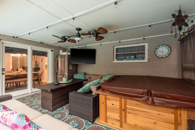7901 Marlboro Dr, Port Richey, FL 34668 - view of patio featuring a hot tub, ceiling fan, and outdoor lounge area
