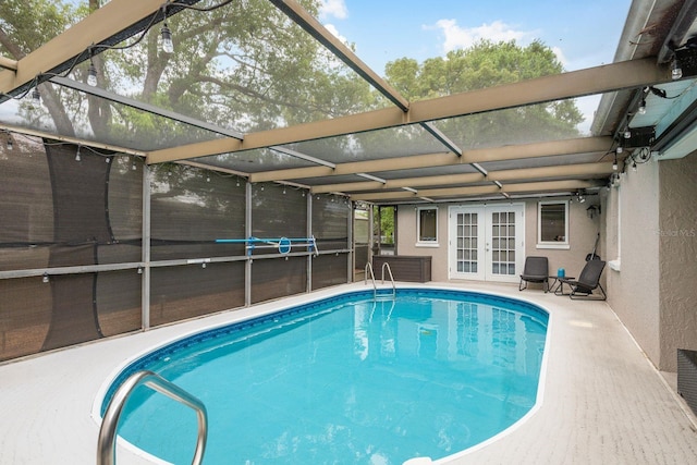 7901 Marlboro Dr, Port Richey, FL 34668 - outdoor pool with french doors, glass enclosure, and a patio area
