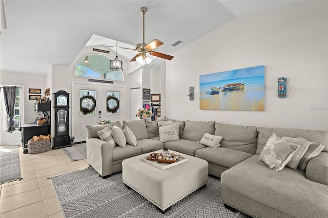 338 7th Ave N, Tierra Verde, FL 33715 - living room featuring ceiling fan, light tile patterned floors, plenty of natural light, and high vaulted ceiling