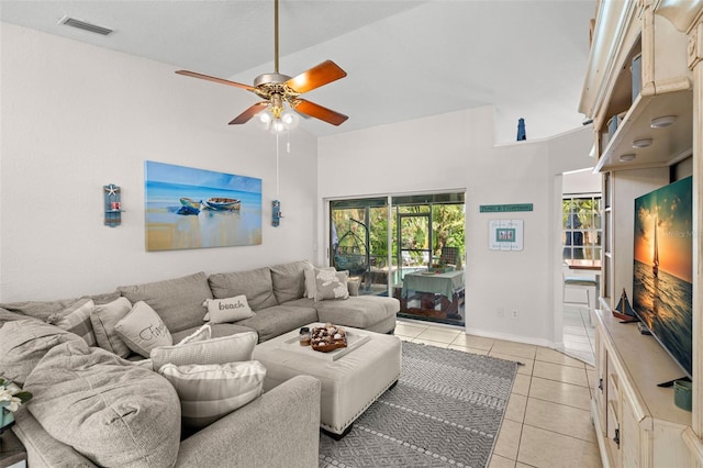 338 7th Ave N, Tierra Verde, FL 33715 - living room featuring a ceiling fan, light tile patterned floors, and baseboards