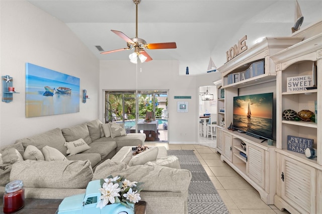 338 7th Ave N, Tierra Verde, FL 33715 - living room with ceiling fan, light tile patterned flooring, and high vaulted ceiling