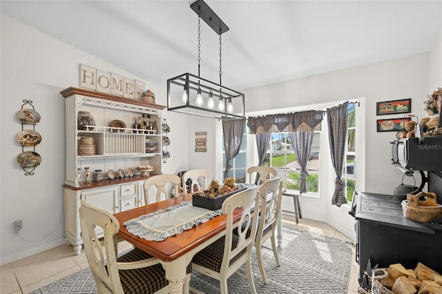 338 7th Ave N, Tierra Verde, FL 33715 - dining space with light tile patterned floors, baseboards, and a chandelier
