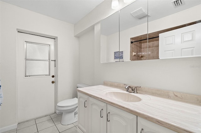 338 7th Ave N, Tierra Verde, FL 33715 - bathroom featuring vanity, toilet, tile patterned flooring, and a shower