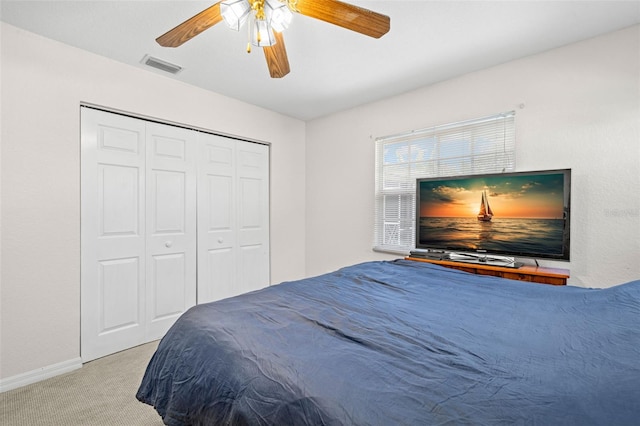 338 7th Ave N, Tierra Verde, FL 33715 - carpeted bedroom featuring ceiling fan, baseboards, and a closet